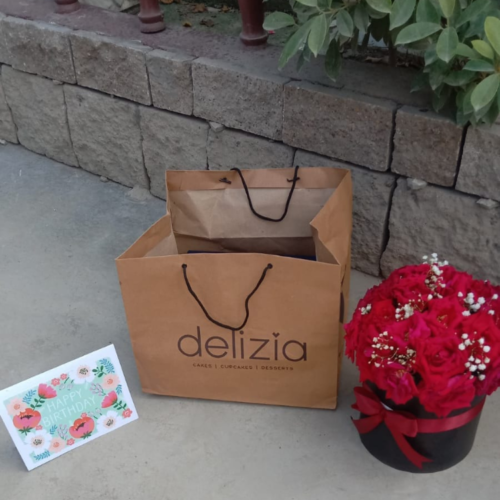 2lb Malt Delizia cake with regular bouquet ,card & delivery (Karachi Only)
